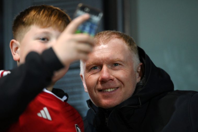 SALFORD, ENGLAND - NOVEMBER 14: Paul Scholes, Co-Owner of Salford City, takes a picture with a Salford City fan ahead of the Emirates FA Cup First Round Replay match between Salford City and Peterborough United at Peninsula Stadium on November 14, 2023 in Salford, England. (Photo by Ben Roberts Photo/Getty Images)
