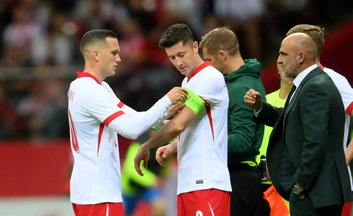 Szymanski giving the captain's arm band to Robert Lewandoski at the 2024 EUROs. (Photo by Adam Nurkiewicz/Getty Images)